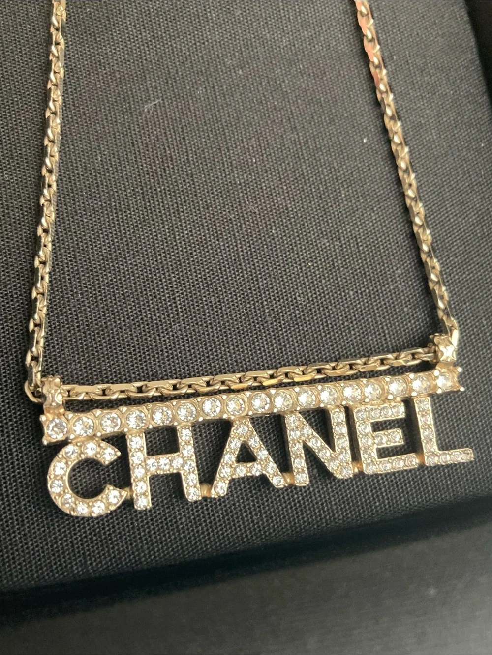 CHANEL Gold and Clear Crystal Logo Necklace